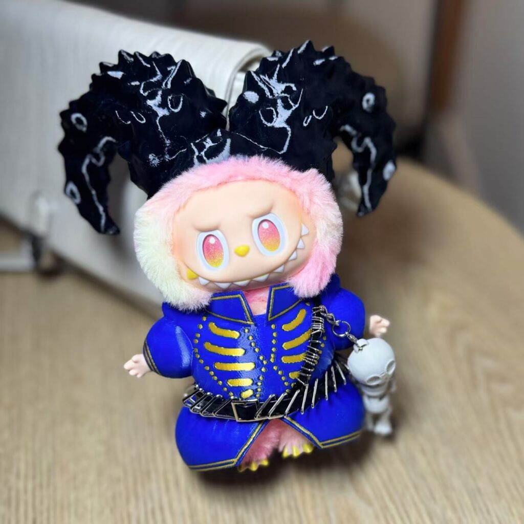 Relive Lady Gaga’s Coachella 2025 “Die With Smile” look with this Labubu doll outfit. Blue-gold design, ram horns, and skull charm make it a rare collectible.