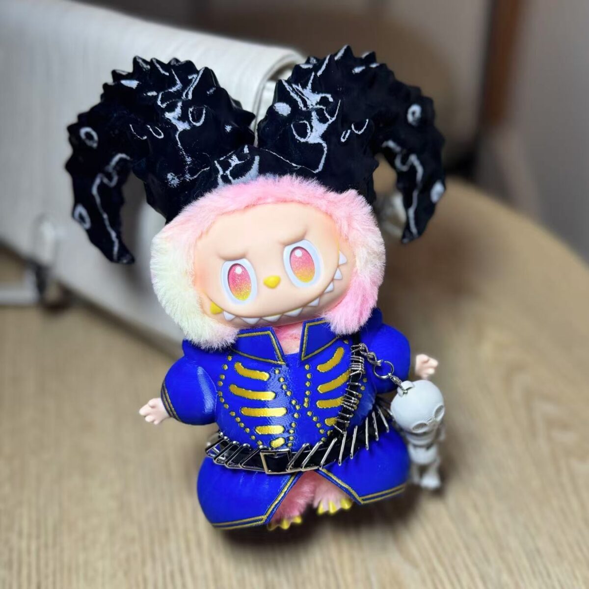 Relive Lady Gaga’s Coachella 2025 “Die With Smile” look with this Labubu doll outfit. Blue-gold design, ram horns, and skull charm make it a rare collectible.