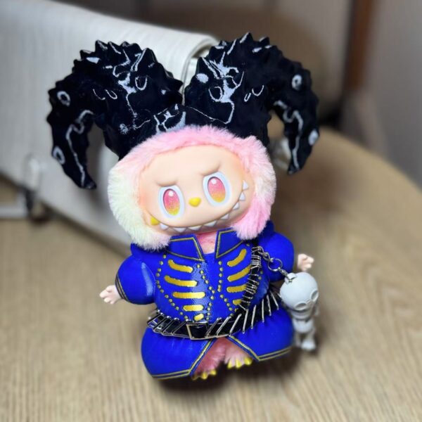 Relive Lady Gaga’s Coachella 2025 “Die With Smile” look with this Labubu doll outfit. Blue-gold design, ram horns, and skull charm make it a rare collectible.